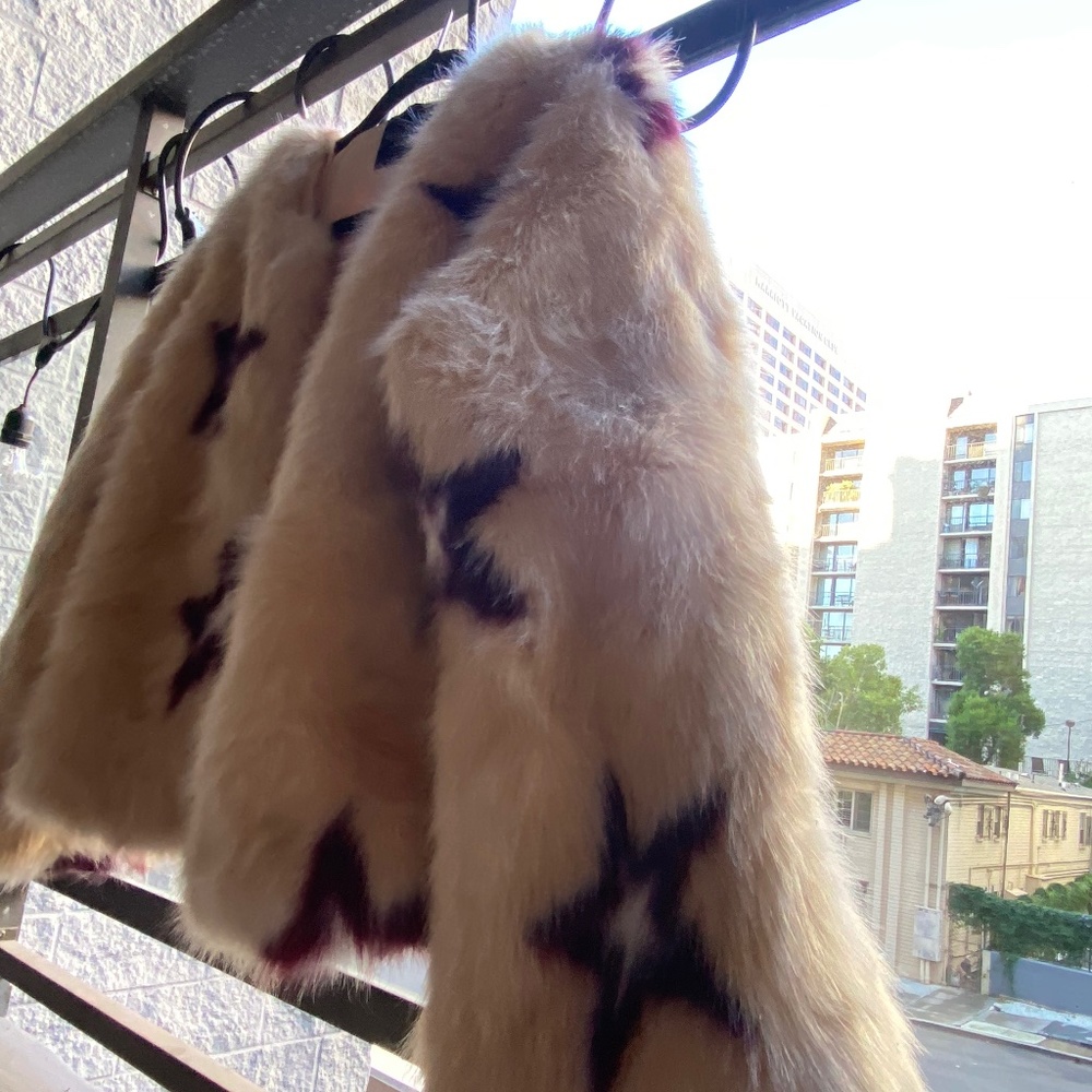 Olivaceous vegan faux fur coat with stars